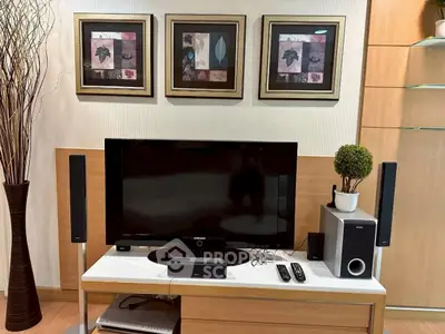 Stylish living room with modern entertainment setup and elegant decor.