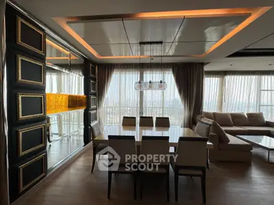 Luxurious dining area with elegant lighting and panoramic city view, perfect for sophisticated gatherings.