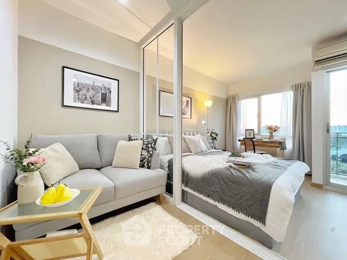 Modern studio apartment with cozy living area and stylish decor