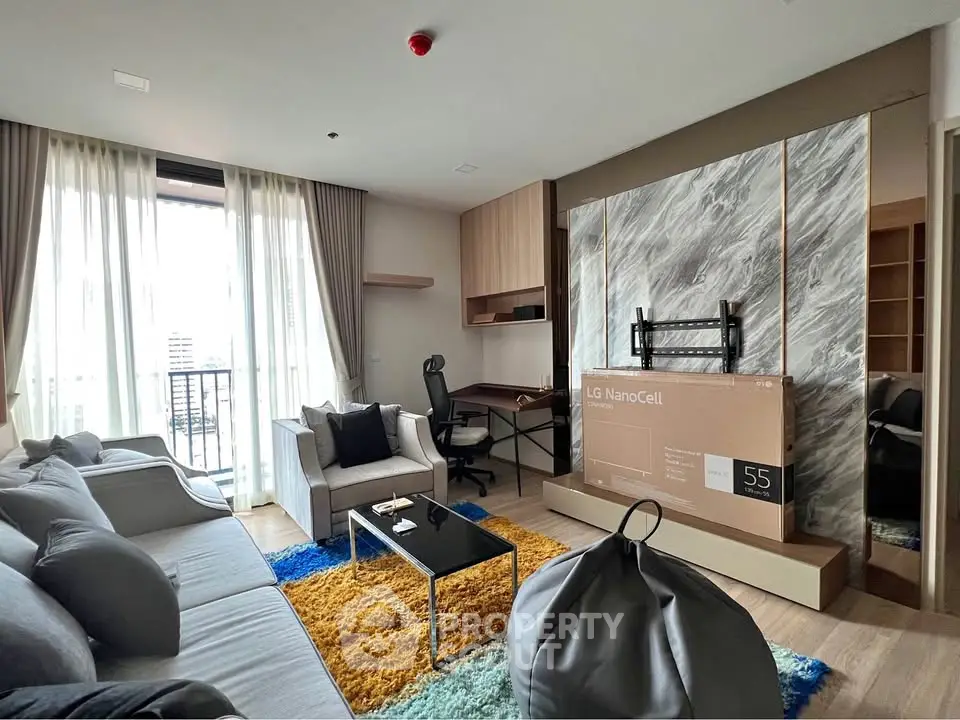 Modern living room with stylish decor and balcony view