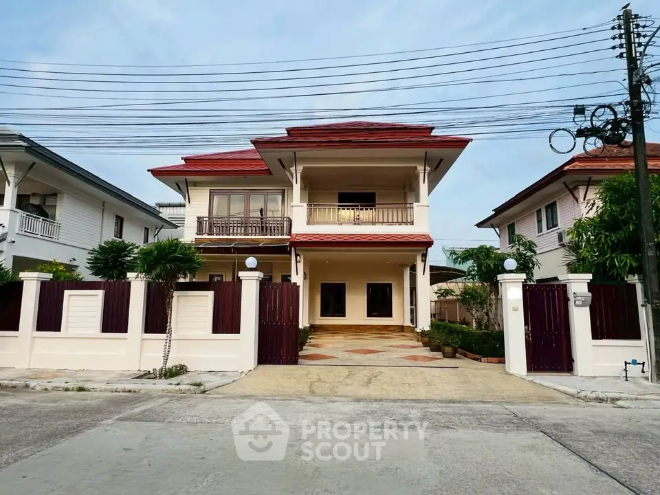 Elegant two-story house with spacious driveway and modern architecture in a serene neighborhood.