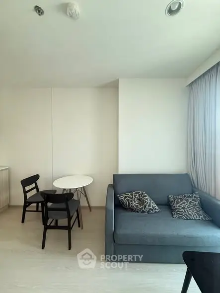 Modern living room with sleek furniture and natural light