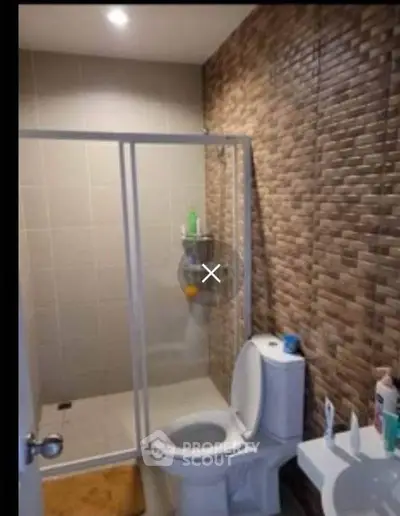 Modern bathroom with stylish tile design and glass shower enclosure
