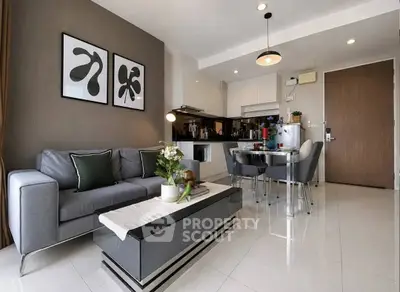 Modern living room with stylish decor and open kitchen layout in a contemporary apartment.