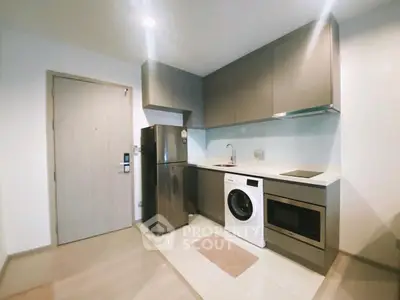 Modern kitchen with sleek appliances and ample storage space