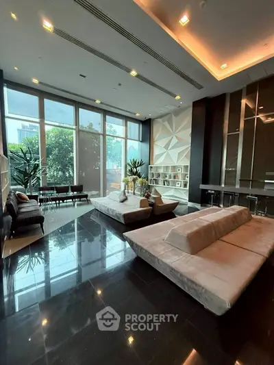 Luxurious modern living room with floor-to-ceiling windows and sleek design