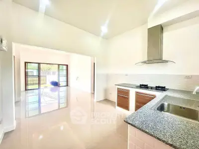 Spacious kitchen with open layout and modern gas stove
