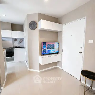 Modern living room with sleek design and open kitchen layout