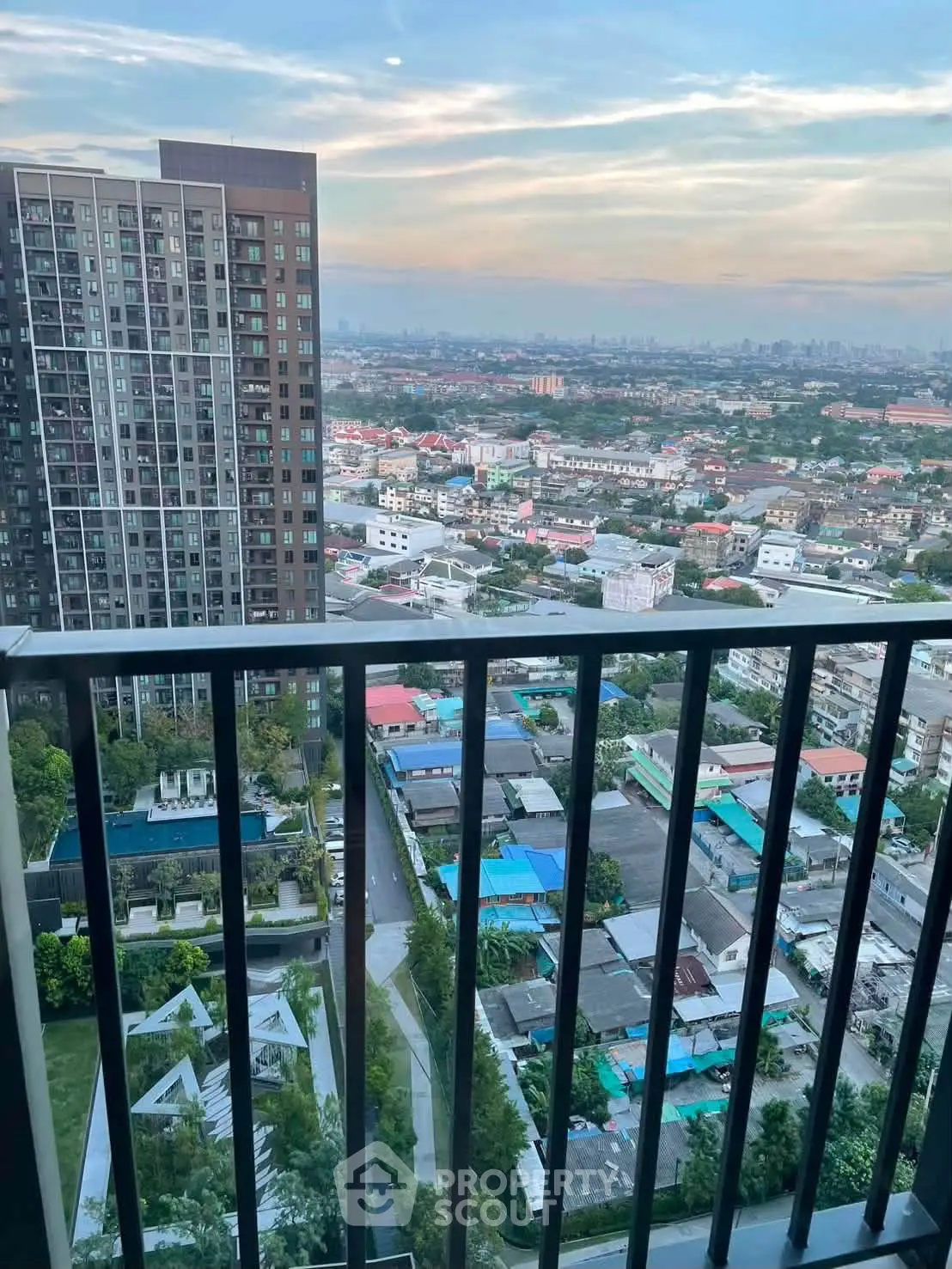Stunning high-rise balcony view overlooking cityscape and skyline, perfect for urban living enthusiasts.