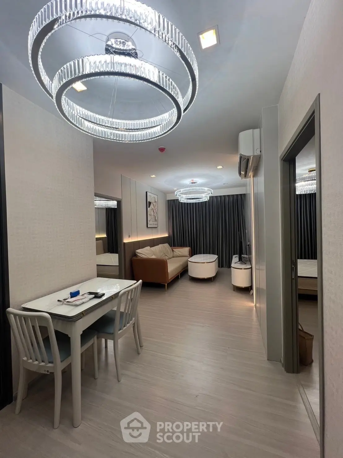 Modern living room with elegant lighting and stylish furniture in a contemporary apartment.