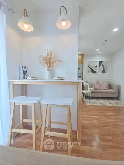 Chic modern living room with stylish bar stools and cozy seating area, perfect for urban living.