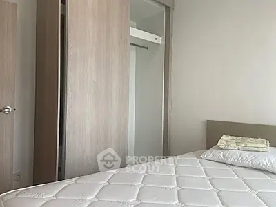 Cozy bedroom with minimalist design and wooden wardrobe