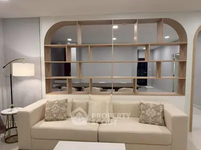 Modern living room with stylish shelving and cozy sofa