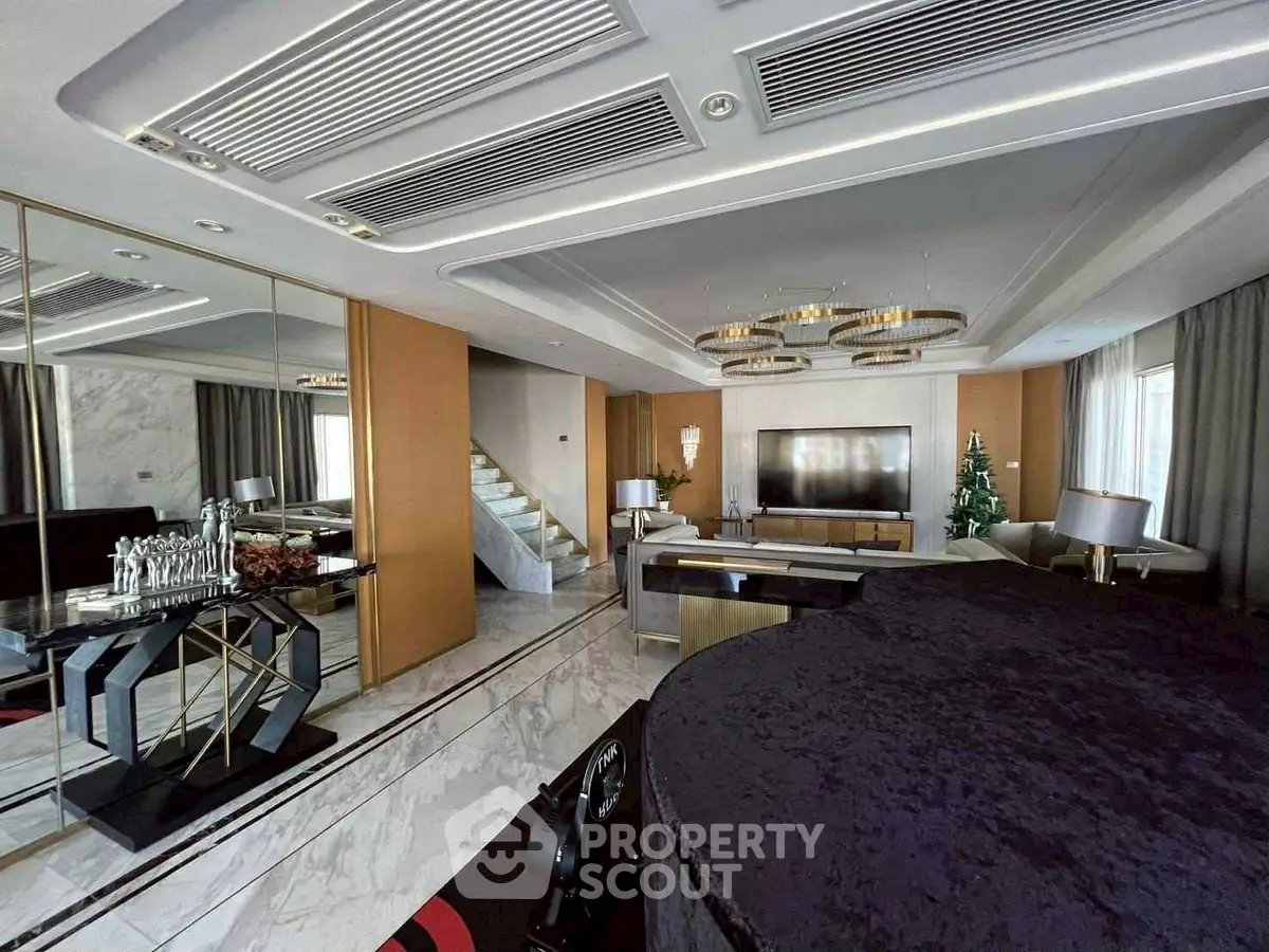 Luxurious living room with modern decor, grand piano, and elegant lighting.
