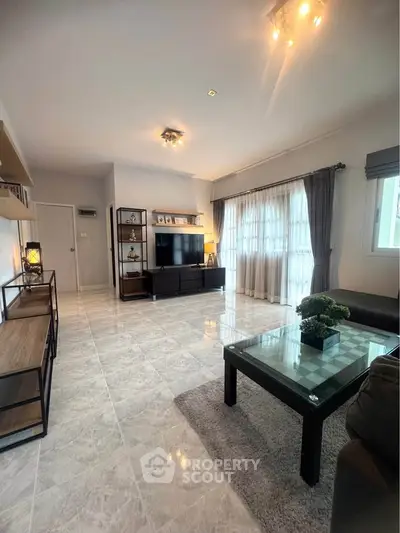 Spacious modern living room with elegant decor and natural light