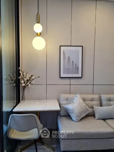 Stylish modern living room with elegant lighting and cozy seating area.