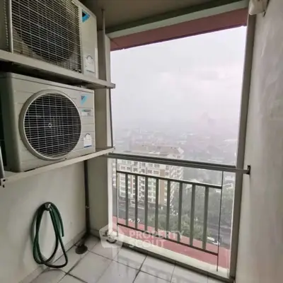 High-rise balcony with city view and air conditioning units, perfect for urban living.