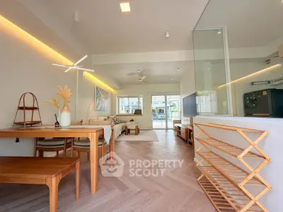 Spacious modern living room with elegant wooden furniture and stylish lighting