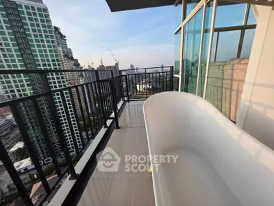 Luxurious balcony with bathtub offering stunning cityscape views in modern high-rise apartment.