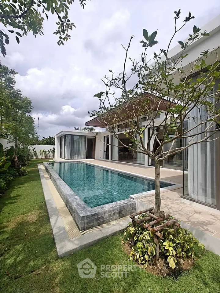 Luxurious modern villa with private pool and lush garden, perfect for serene living and entertaining.