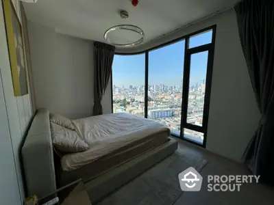 Luxurious bedroom with panoramic city view in modern high-rise apartment