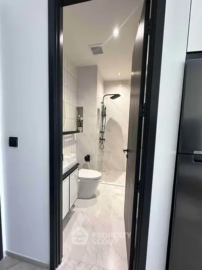 Modern bathroom with sleek design and elegant fixtures in a contemporary apartment.