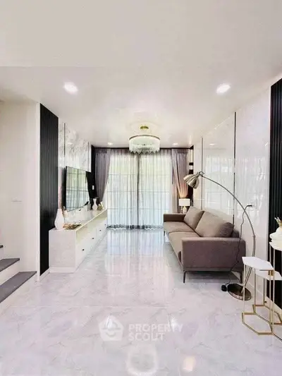 Elegant living room with modern decor and large windows for natural light.