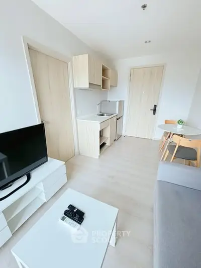 Modern minimalist living room with compact kitchen and dining area