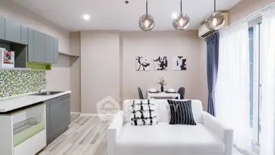 Modern open-plan living room with stylish decor and dining area