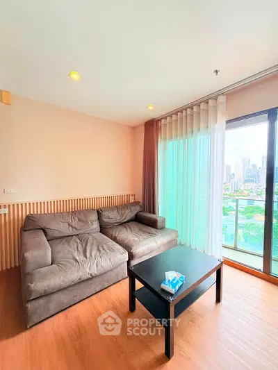 Spacious living room with city view and cozy sofa in modern apartment