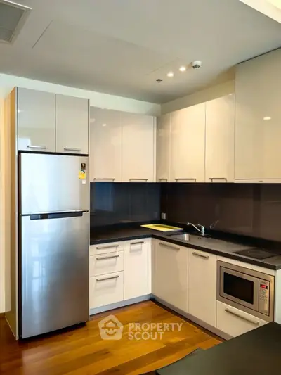 Modern kitchen with sleek cabinets and stainless steel appliances