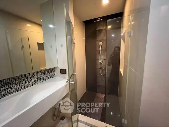 Modern bathroom with sleek shower and stylish sink area