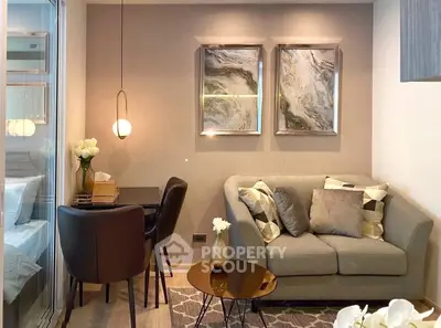 Stylish modern living room with cozy sofa and elegant dining area in a compact space.