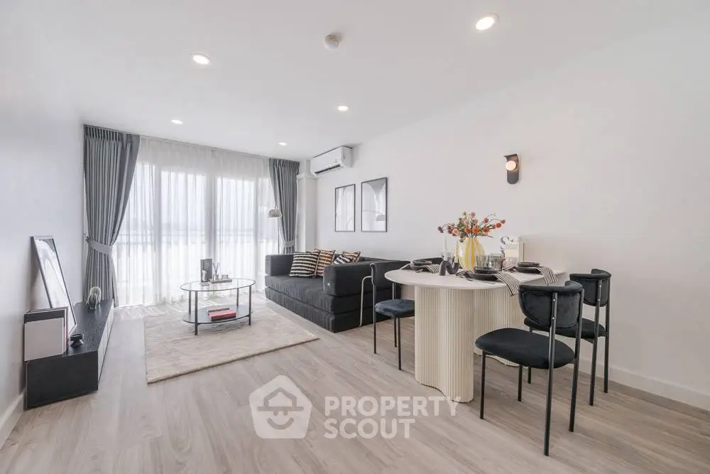 Spacious modern living room with elegant decor and natural light