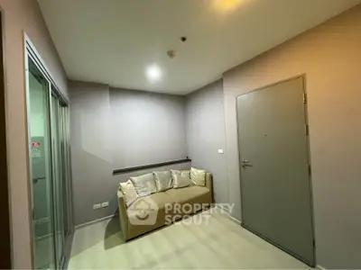 Cozy small living room with modern sofa and neutral tones