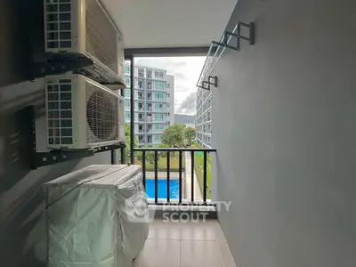 Modern balcony with pool view in urban apartment complex