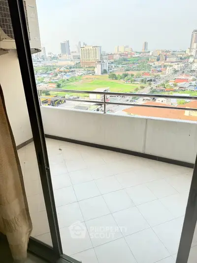 Spacious balcony with stunning city view, perfect for relaxation and enjoying the skyline.