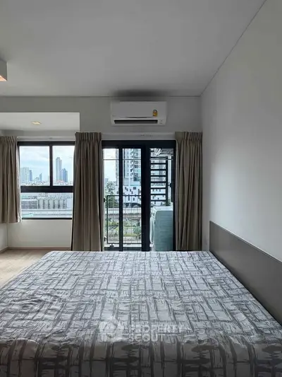 Modern bedroom with city view and air conditioning in high-rise apartment