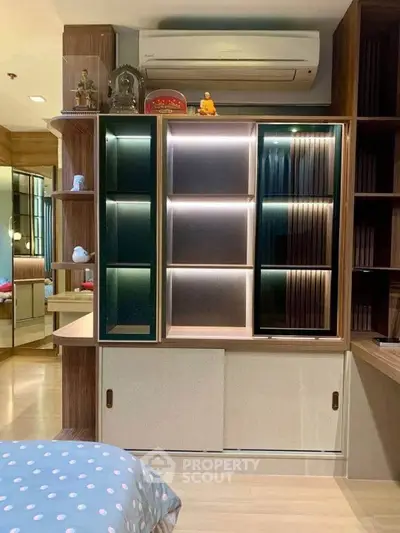 Modern bedroom with stylish shelving and air conditioning unit, perfect for comfort and organization.