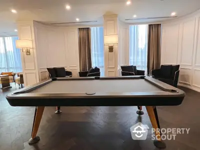 Luxurious living room with elegant pool table and stylish seating area