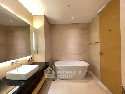 Luxurious modern bathroom with sleek design and elegant bathtub.