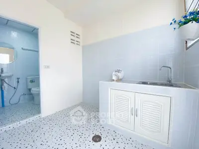 Bright bathroom with modern fixtures and a sleek sink area