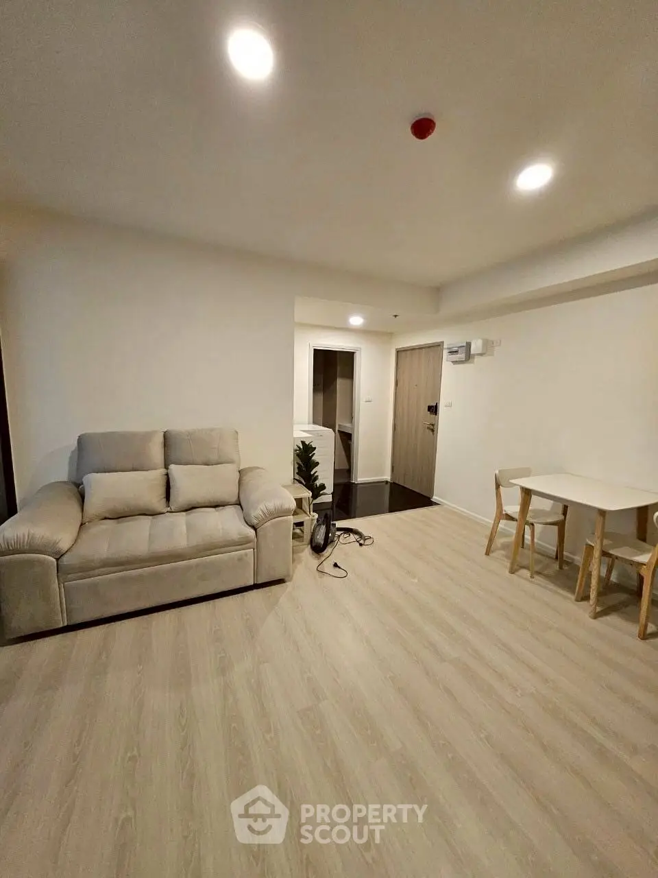 Spacious living room with modern decor and cozy seating area