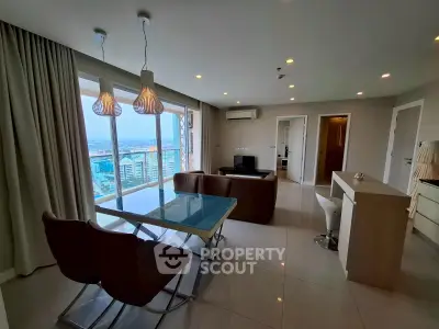 Spacious living room with panoramic city view and modern furnishings