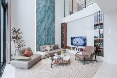 Luxurious modern living room with high ceilings and elegant decor