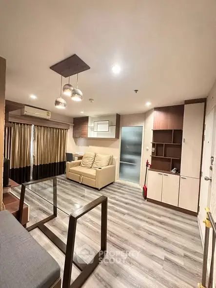 Modern living room with stylish lighting and cozy seating area.