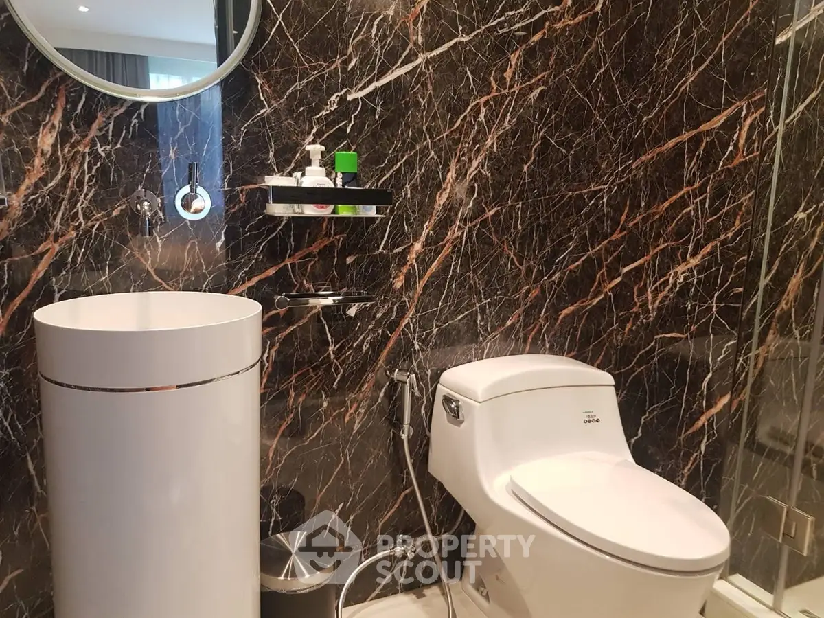 Luxurious bathroom with elegant marble walls and modern fixtures