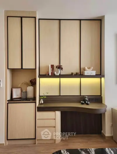 Modern study area with sleek wooden cabinetry and ambient lighting