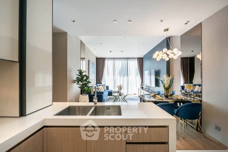 Luxurious open-plan living room with modern kitchen and elegant dining area