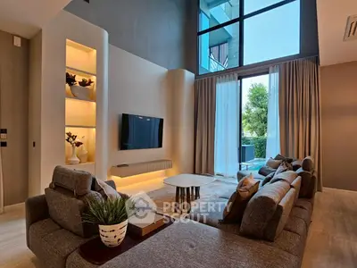 Luxurious modern living room with high ceilings and large windows